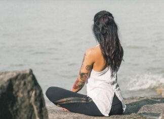 Mental Health Awareness: The Growing Focus on Emotional Well-being Free tattooed woman doing yoga