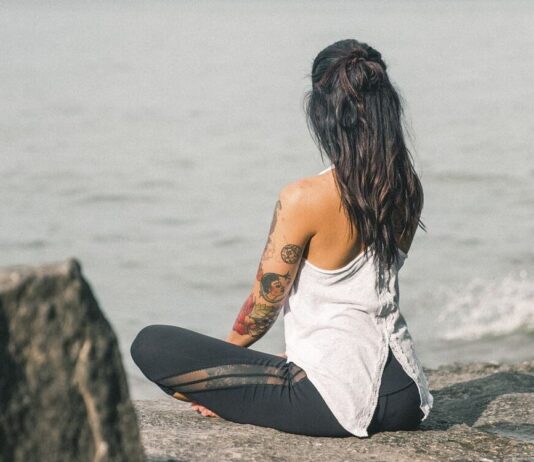 Mental Health Awareness: The Growing Focus on Emotional Well-being Free tattooed woman doing yoga