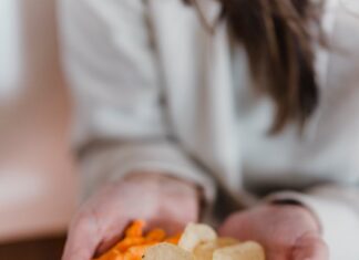 The Ultimate Game Day Snack Lineup: Healthy Choices for Football Fans! female holding tasty snacks in hands