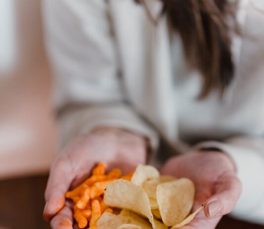 The Ultimate Game Day Snack Lineup: Healthy Choices for Football Fans! female holding tasty snacks in hands