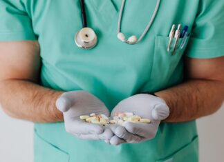 Medication Safety for Seniors: What Older Adults Need to Know faceless doctor with pills in hands