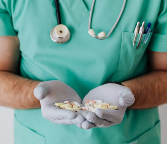 Medication Safety for Seniors: What Older Adults Need to Know faceless doctor with pills in hands