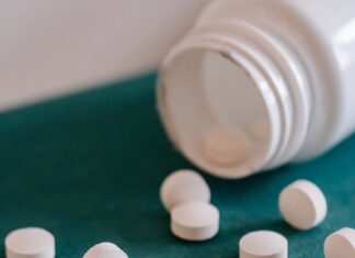 Prescription Drug Abuse: Risks, Recognition, and Prevention heap of pills spilled from container