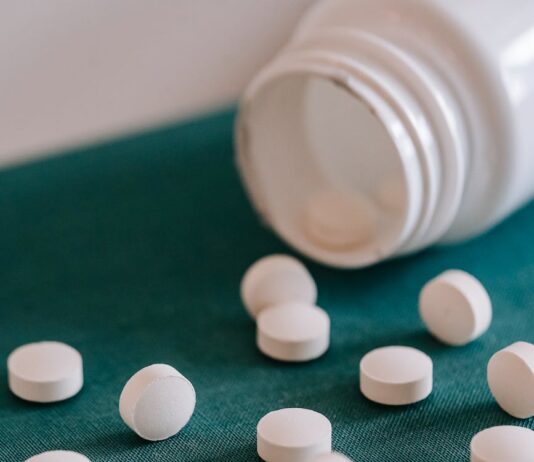 Prescription Drug Abuse: Risks, Recognition, and Prevention heap of pills spilled from container