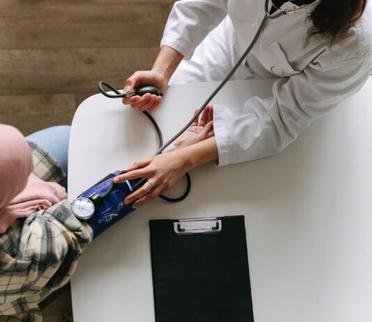 Cancer Prevention: How Lifestyle Choices Can Reduce Your Risk a doctor taking patient s blood pressure