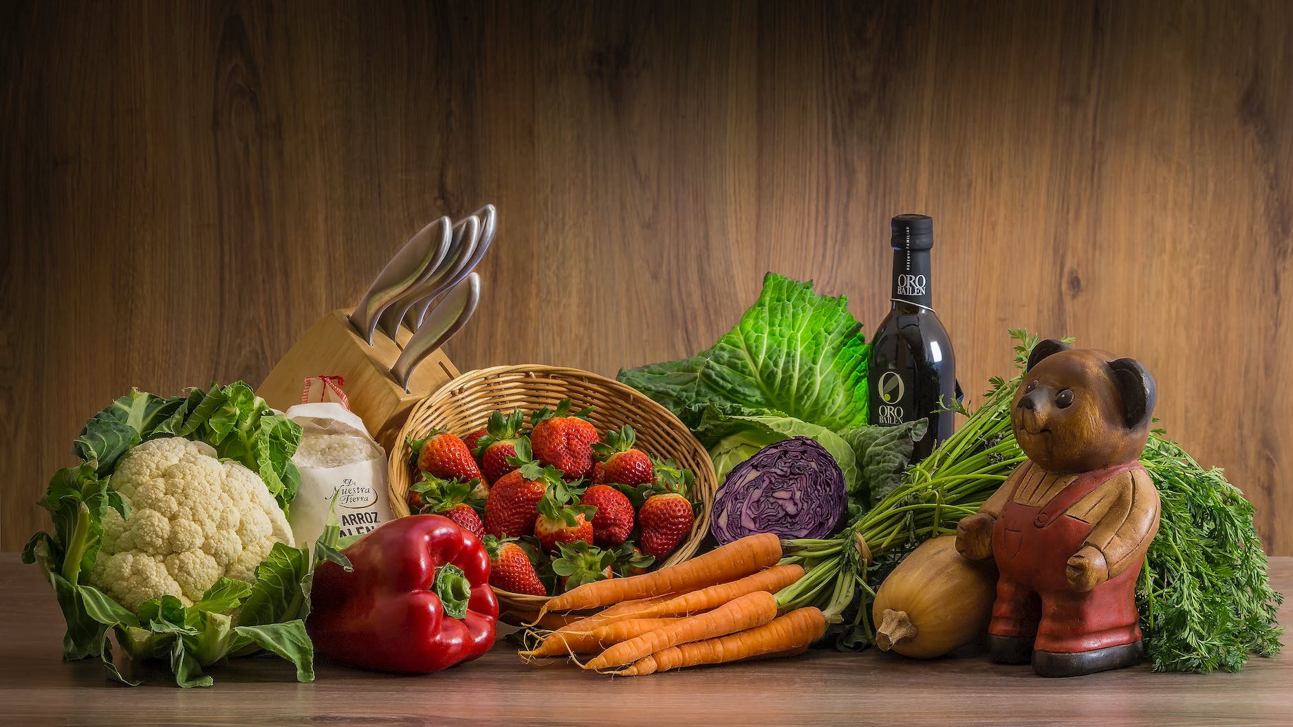 strawberries and vegetables on table