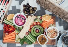Healthy and Delicious Snacks for the Big Game Party sliced watermelon and green vegetable on white ceramic plate