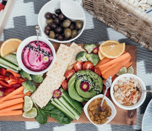 Healthy and Delicious Snacks for the Big Game Party sliced watermelon and green vegetable on white ceramic plate