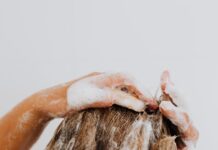 Anti-Dandruff Shampoos May Help Slow Male Pattern or Female Pattern Hair Loss woman washing her hair