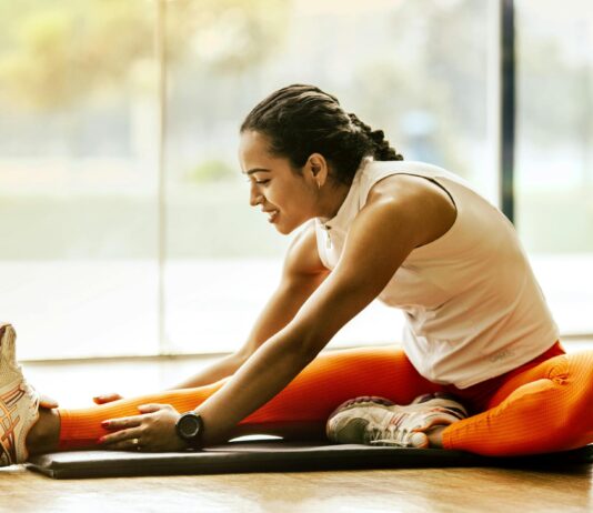 Stretching Isn’t Always the Answer for Pain and Muscle Tension woman stretching on ground
