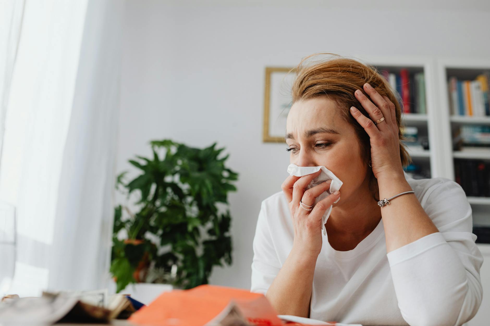 unhappy woman crying at home